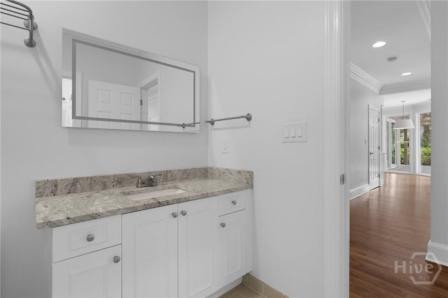 8 Boars Nest Ln, Savannah, GA 31411 - bathroom with ornamental molding, wood finished floors, vanity, and recessed lighting