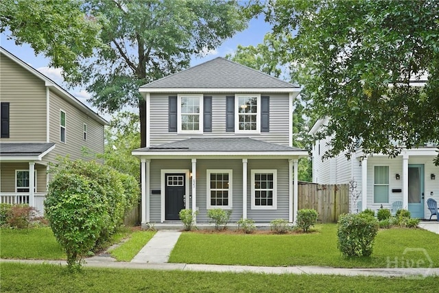 623 E Henry St, Savannah, GA 31401 - view of front facade with covered porch and roof with shingles