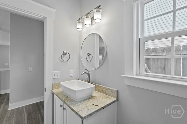 623 E Henry St, Savannah, GA 31401 - bathroom featuring vanity and wood finished floors