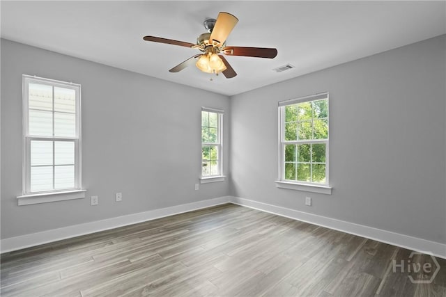 623 E Henry St, Savannah, GA 31401 - spare room with wood finished floors and ceiling fan