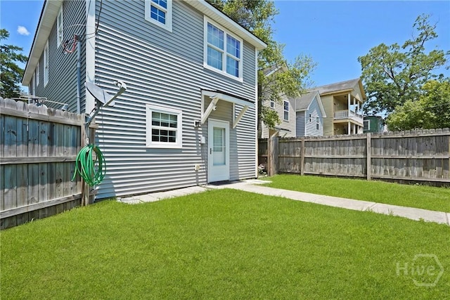 623 E Henry St, Savannah, GA 31401 - rear view of property with a fenced backyard