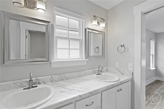623 E Henry St, Savannah, GA 31401 - bathroom with double vanity and wood finished floors