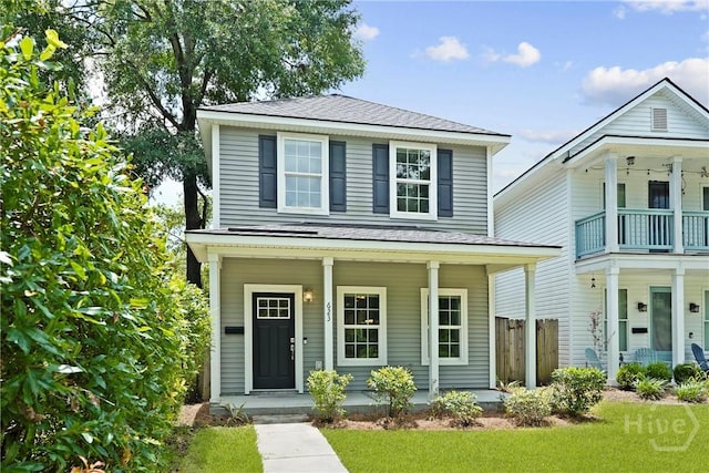 623 E Henry St, Savannah, GA 31401 - view of front of house with covered porch and a shingled roof