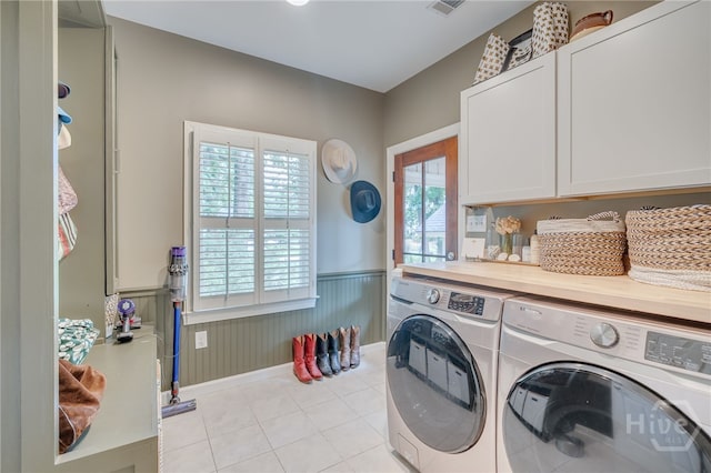3 Franklin Creek Rd S, Savannah, GA 31411 - laundry room featuring cabinet space, washer and dryer, a wainscoted wall, and light tile patterned flooring