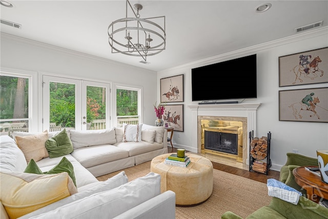 3 Franklin Creek Rd S, Savannah, GA 31411 - living area with crown molding, a chandelier, wood finished floors, a fireplace with flush hearth, and recessed lighting