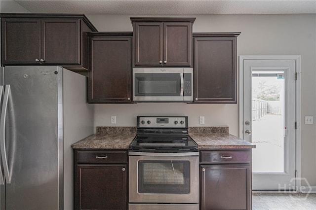 1506 Bayberry Dr, Hinesville, GA 31313 - kitchen with stainless steel appliances, dark brown cabinets, and dark countertops