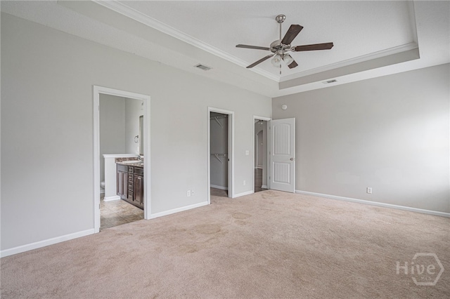 1506 Bayberry Dr, Hinesville, GA 31313 - unfurnished bedroom featuring a raised ceiling, crown molding, a spacious closet, light colored carpet, and a closet