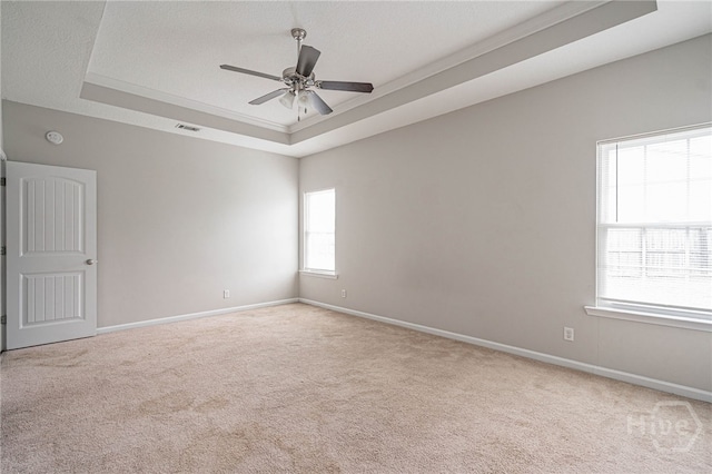 1506 Bayberry Dr, Hinesville, GA 31313 - spare room with a tray ceiling, carpet, and a ceiling fan