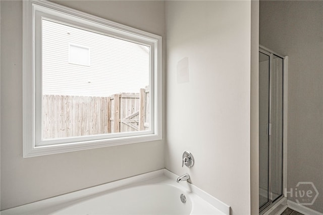 1506 Bayberry Dr, Hinesville, GA 31313 - bathroom with a stall shower and a garden tub