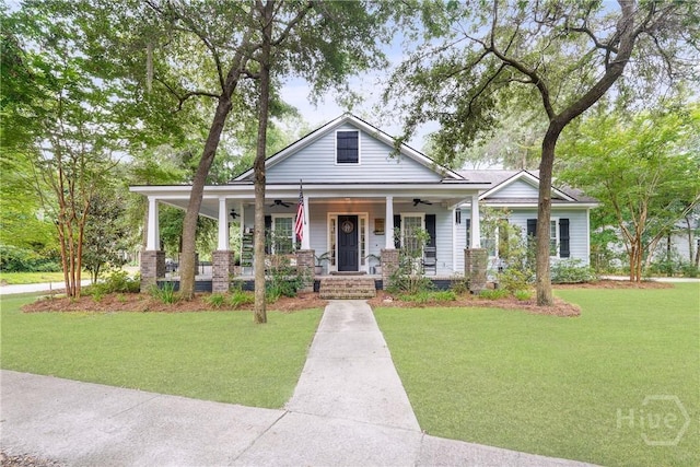 370 Blackjack Oak Dr W, Richmond Hill, GA 31324 - view of front of property featuring ceiling fan, a porch, and a front yard