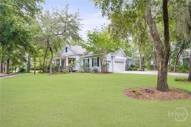 370 Blackjack Oak Dr W, Richmond Hill, GA 31324 - view of front of house featuring covered porch, a front lawn, driveway, and a garage