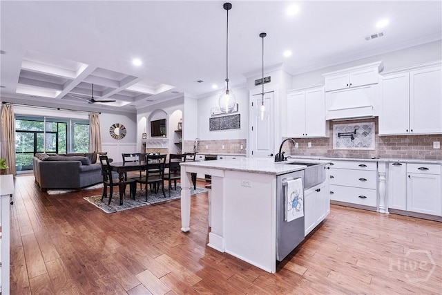 370 Blackjack Oak Dr W, Richmond Hill, GA 31324 - kitchen featuring a ceiling fan, a kitchen island with sink, open floor plan, white cabinets, and beam ceiling