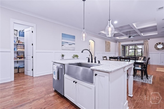 370 Blackjack Oak Dr W, Richmond Hill, GA 31324 - kitchen featuring dishwasher, a decorative wall, coffered ceiling, a center island with sink, and white cabinets