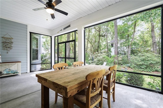 370 Blackjack Oak Dr W, Richmond Hill, GA 31324 - sunroom with a ceiling fan, carpet floors, wooden walls, and outdoor dining area