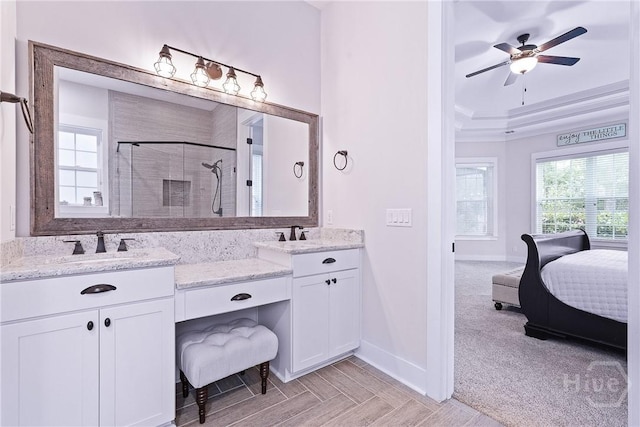 370 Blackjack Oak Dr W, Richmond Hill, GA 31324 - ensuite bathroom with a shower stall, plenty of natural light, double vanity, and ceiling fan