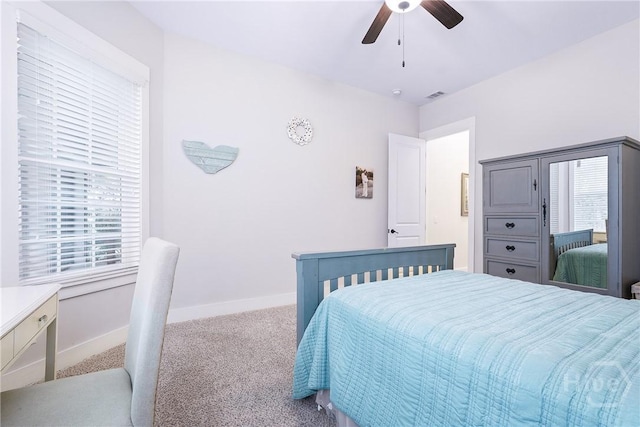 370 Blackjack Oak Dr W, Richmond Hill, GA 31324 - carpeted bedroom featuring multiple windows and ceiling fan