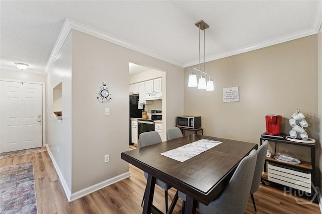 12300 Apache Ave Unit 1003, Savannah, GA 31419 - dining space with crown molding and light wood finished floors