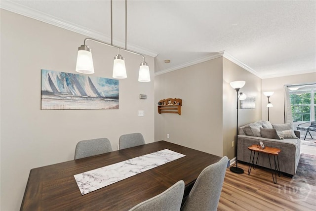 12300 Apache Ave Unit 1003, Savannah, GA 31419 - dining area featuring wood finished floors and crown molding