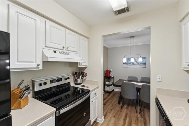12300 Apache Ave Unit 1003, Savannah, GA 31419 - kitchen with exhaust hood, stainless steel appliances, light countertops, and crown molding
