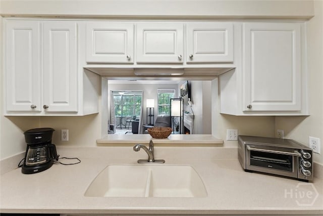 12300 Apache Ave Unit 1003, Savannah, GA 31419 - kitchen with light countertops and white cabinets