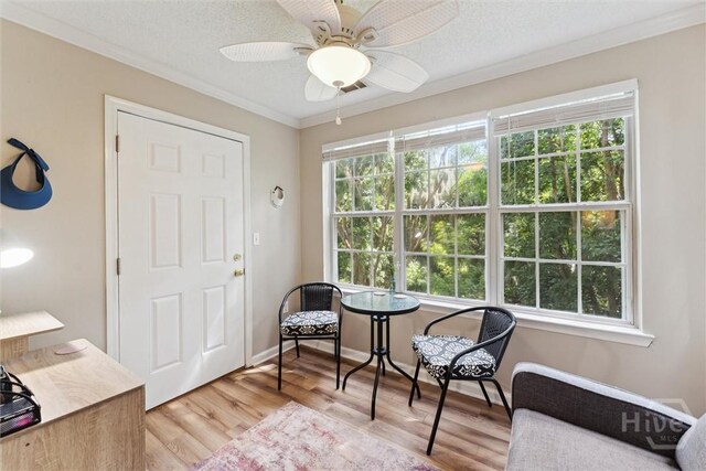 12300 Apache Ave Unit 1003, Savannah, GA 31419 - living area featuring wood finished floors, crown molding, ceiling fan, and a textured ceiling