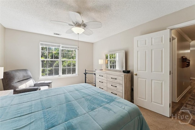 12300 Apache Ave Unit 1003, Savannah, GA 31419 - carpeted bedroom featuring a textured ceiling and ceiling fan