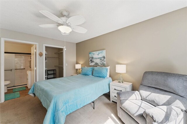 12300 Apache Ave Unit 1003, Savannah, GA 31419 - carpeted bedroom featuring a spacious closet, connected bathroom, a ceiling fan, and a closet