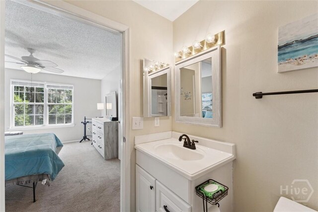 12300 Apache Ave Unit 1003, Savannah, GA 31419 - bathroom with vanity, ensuite bathroom, and a ceiling fan