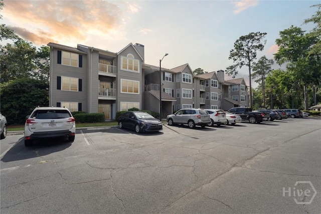 12300 Apache Ave Unit 1003, Savannah, GA 31419 - view of apartment building / complex featuring uncovered parking