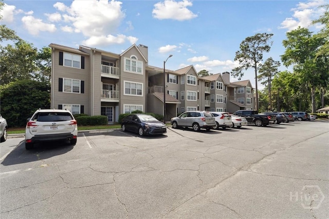 12300 Apache Ave Unit 1003, Savannah, GA 31419 - view of apartment building / complex featuring uncovered parking