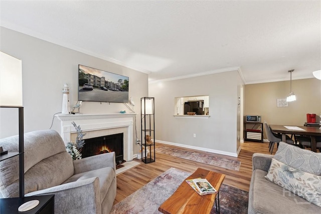 12300 Apache Ave Unit 1003, Savannah, GA 31419 - living room featuring wood finished floors, ornamental molding, and a tile fireplace