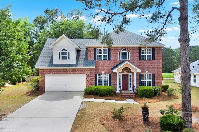 306 Walthour Dr, Rincon, GA 31326 - view of front of home with concrete driveway, brick siding, roof with shingles, and an attached garage