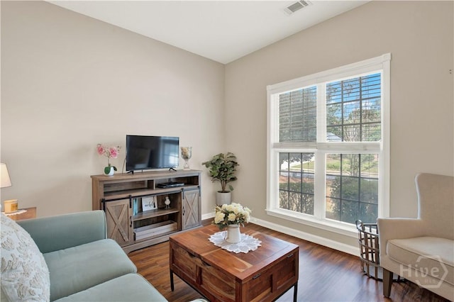 306 Walthour Dr, Rincon, GA 31326 - living area featuring healthy amount of natural light and wood finished floors