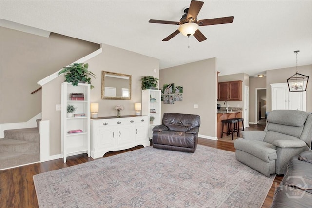 306 Walthour Dr, Rincon, GA 31326 - living room featuring dark wood finished floors, ceiling fan, and stairs