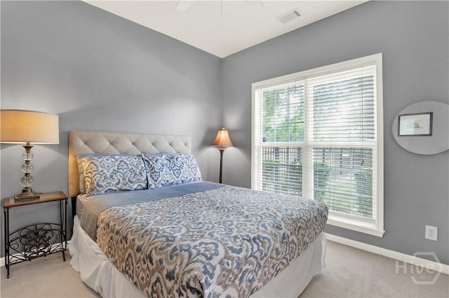 306 Walthour Dr, Rincon, GA 31326 - bedroom with light carpet, multiple windows, and ceiling fan