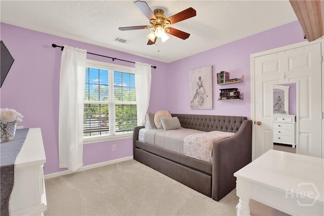 306 Walthour Dr, Rincon, GA 31326 - bedroom with light carpet, a textured ceiling, and ceiling fan