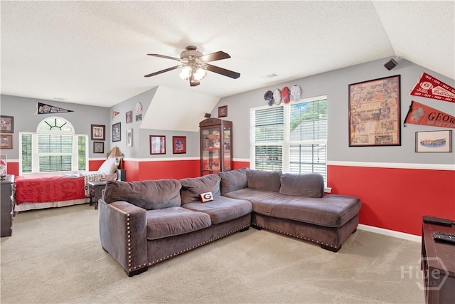 306 Walthour Dr, Rincon, GA 31326 - living room with light colored carpet, vaulted ceiling, a ceiling fan, and a textured ceiling