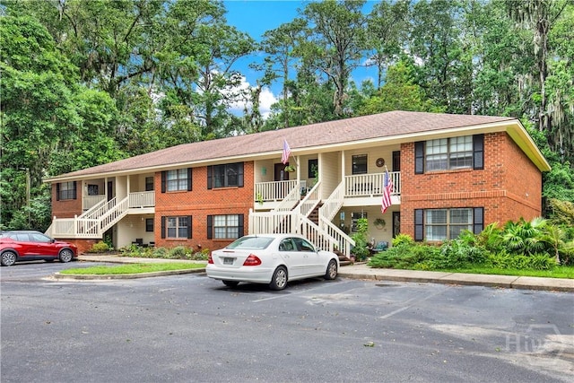 25 Colony Park Dr, Savannah, GA 31406 - view of building exterior with stairway and uncovered parking
