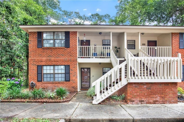 25 Colony Park Dr, Savannah, GA 31406 - view of front of home featuring stairs, brick siding, and covered porch