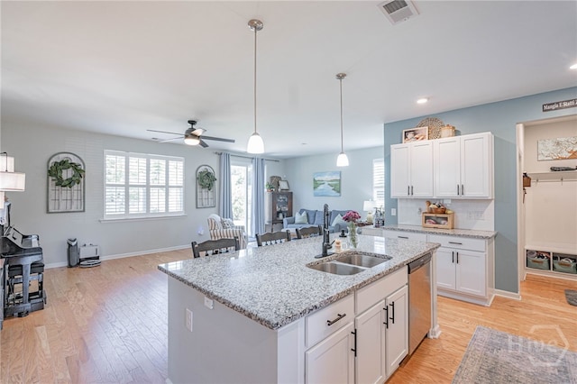 143 Arusha Ave, Savannah, GA 31419 - kitchen featuring open floor plan, dishwasher, light wood-style flooring, white cabinetry, and recessed lighting