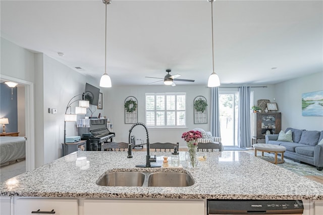 143 Arusha Ave, Savannah, GA 31419 - kitchen featuring open floor plan, an island with sink, and light stone countertops
