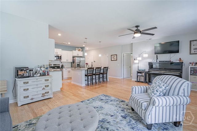 143 Arusha Ave, Savannah, GA 31419 - living room with light wood finished floors, a ceiling fan, and recessed lighting