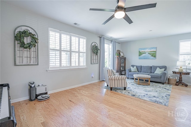 143 Arusha Ave, Savannah, GA 31419 - living room featuring wood finished floors, healthy amount of natural light, and ceiling fan