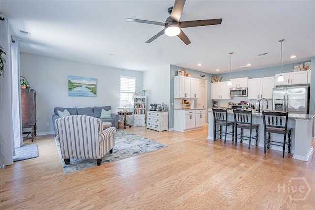 143 Arusha Ave, Savannah, GA 31419 - living room featuring ceiling fan, light wood-type flooring, and recessed lighting