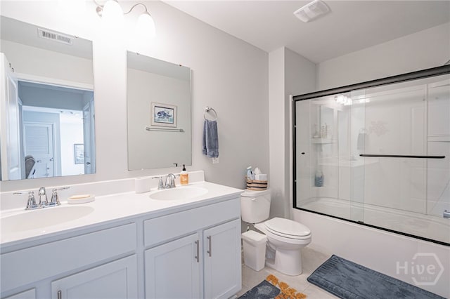 143 Arusha Ave, Savannah, GA 31419 - full bath with double vanity, tile patterned floors, and shower / bath combination with glass door