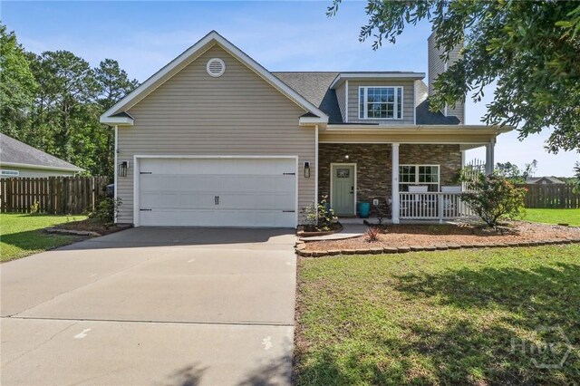 18 Sagefield Dr, Ellabell, GA 31308 - view of front of property featuring covered porch, driveway, stone siding, a chimney, and an attached garage