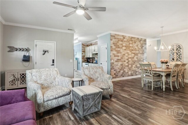 18 Sagefield Dr, Ellabell, GA 31308 - living room featuring crown molding, dark wood-style floors, ceiling fan, a chandelier, and brick wall