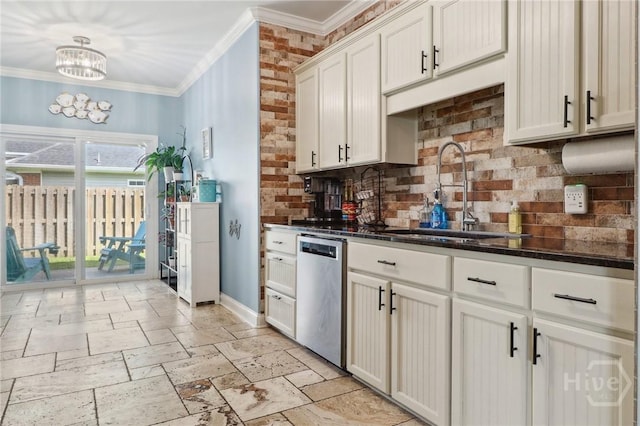 18 Sagefield Dr, Ellabell, GA 31308 - kitchen featuring dishwasher, ornamental molding, tasteful backsplash, a chandelier, and stone tile flooring