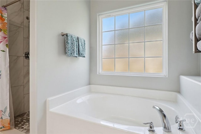 18 Sagefield Dr, Ellabell, GA 31308 - full bathroom featuring a shower stall, a bath, and healthy amount of natural light