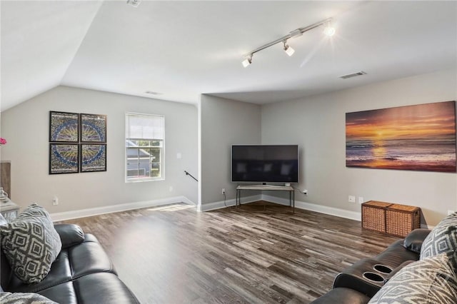 18 Sagefield Dr, Ellabell, GA 31308 - living room with wood finished floors, rail lighting, and lofted ceiling